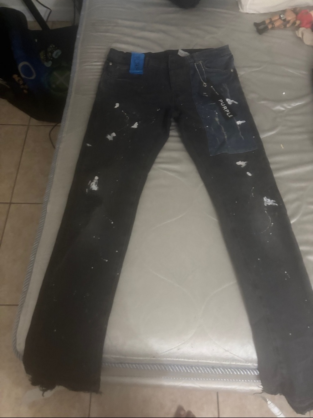 Slim Straight Black Paint-Splatter Jeans with Blue Patch